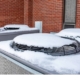 Close up of snow on top of an HVAC unit