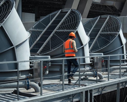 Man inspecting commercial HVAC chillers
