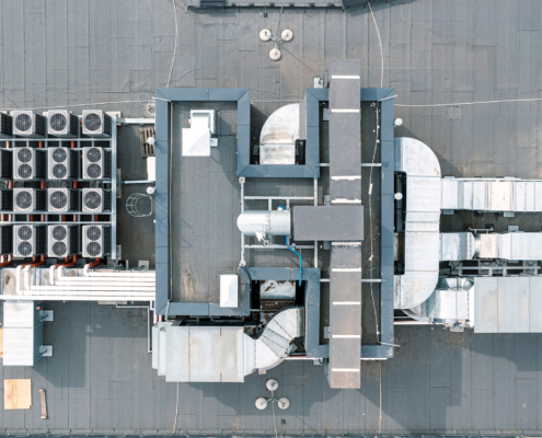 air conditioner fans, ventilation system on the roof of building, aerial view