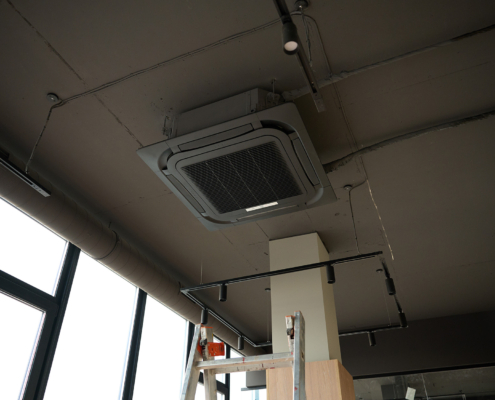 Ceiling mounted cassette air conditioner in modern building