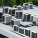 The external units of the commercial air conditioning and ventilation systems are installed on the roof of an industrial building