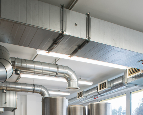 Ventilation pipe system in kitchen interior