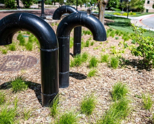 Underground structure manhole ventilation pipe in the shape of a candy cane