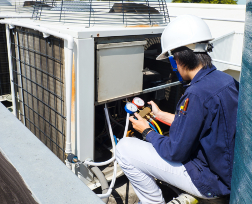 Technician is checking air conditioner